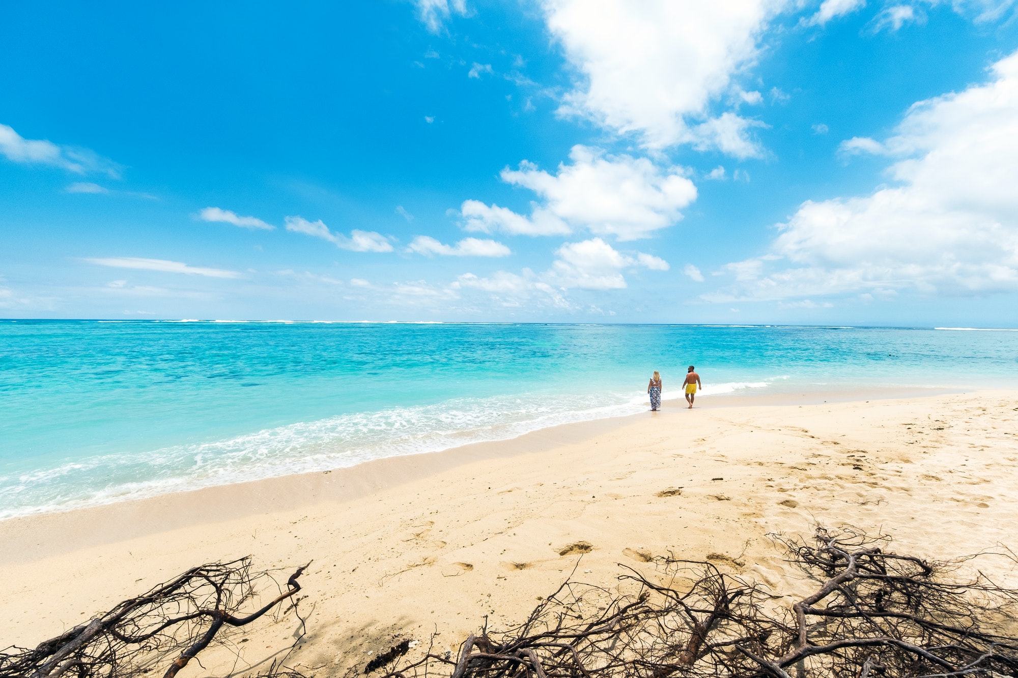 a couple on the beach in Le Morne Brabant, Mauritius in the Indian Ocean