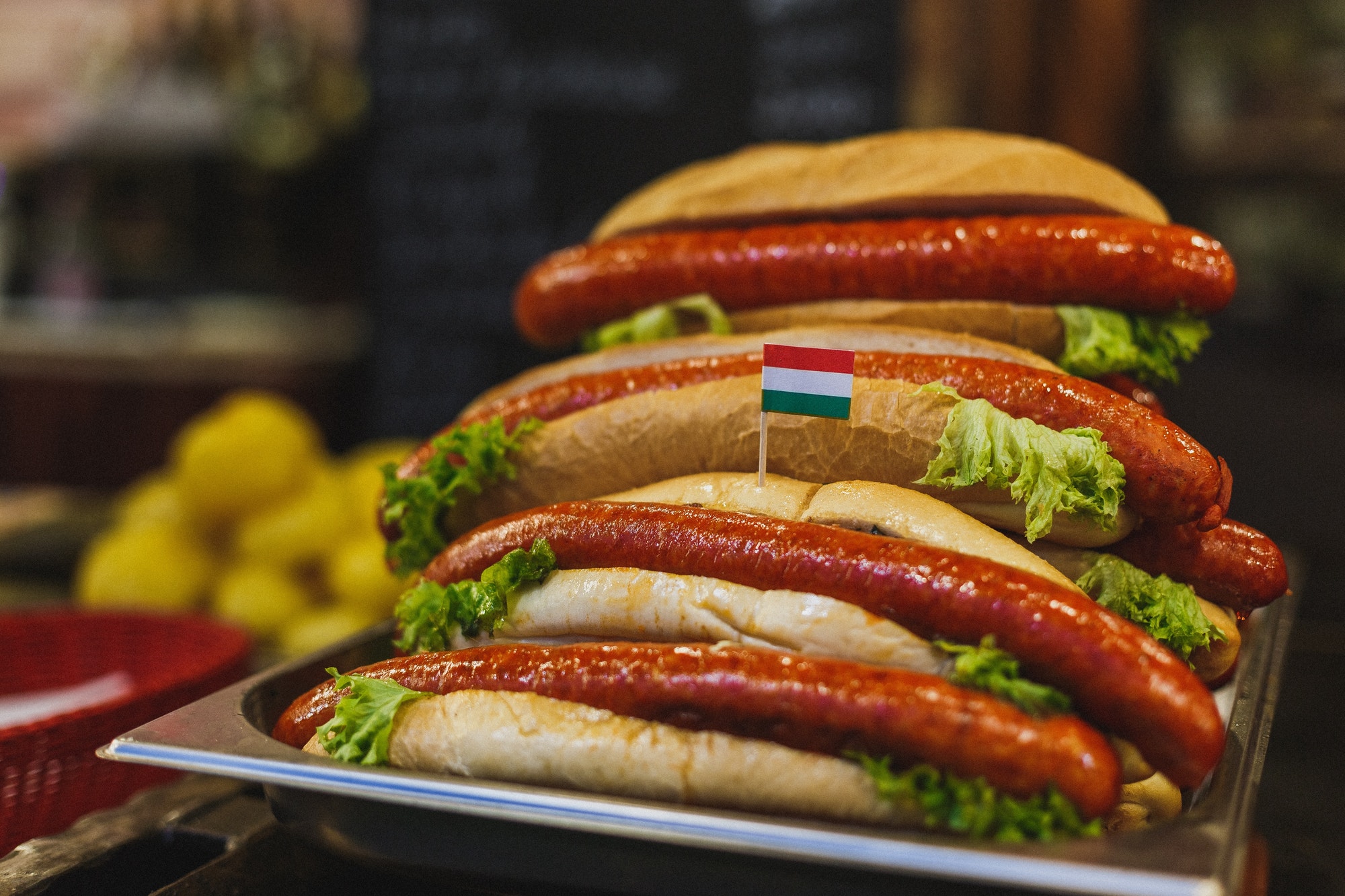 Grilled meats on a stand at christmas fair in Budapest. Christmas market in Budapest. Hotdogs