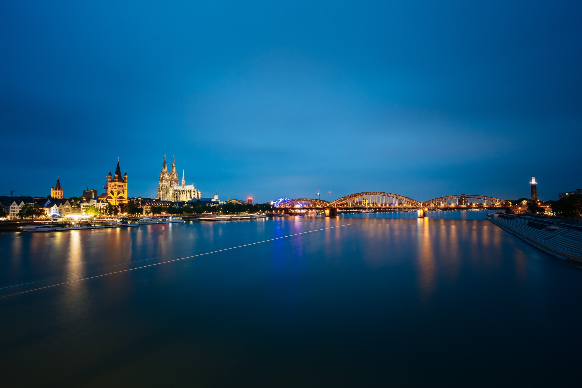 Night View Of Cologne Cathedral And Hohenzollern Bridge, Germany